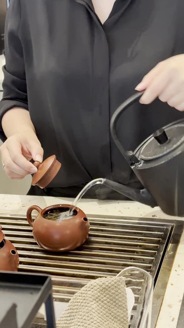 close up of woman brewingtea at tea rock kl