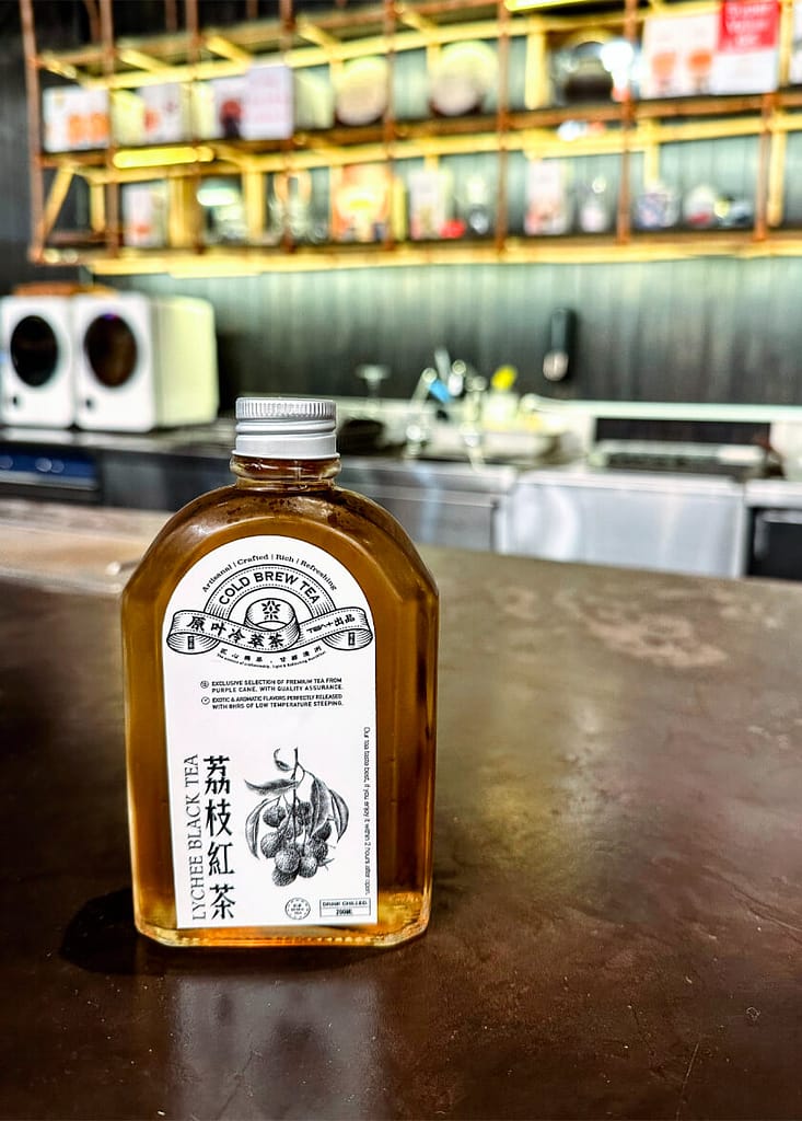 a bottle of Lychee black tea cold vrew from Tea+