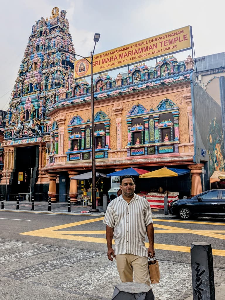 man standing in front of Sri Maha Mariamman Temple on the way to Niko Neko Chintatown KL